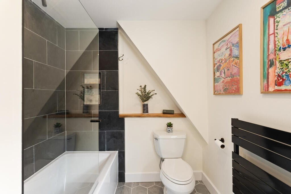 7 Charles Street Maynard, MA 01754 - Photo 16 of 33 a bathroom with a toilet and a shower