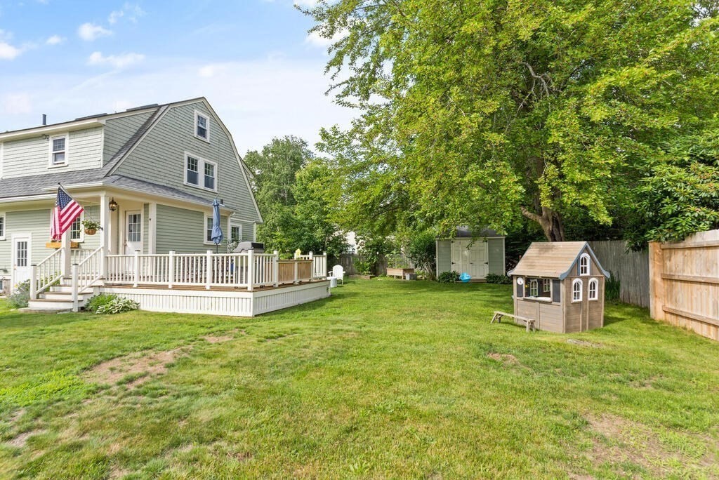 7 Charles Street Maynard, MA 01754 - Photo 28 of 33 a view of a house with a big yard and large trees