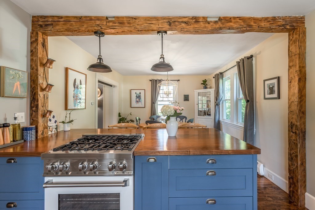 7 Charles Street Maynard, MA 01754 - Photo 5 of 33 a kitchen with a stove and cabinets