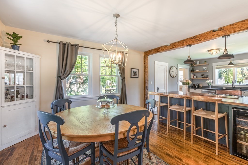 7 Charles Street Maynard, MA 01754 - Photo 8 of 33 a dining room with furniture a chandelier and wooden floor