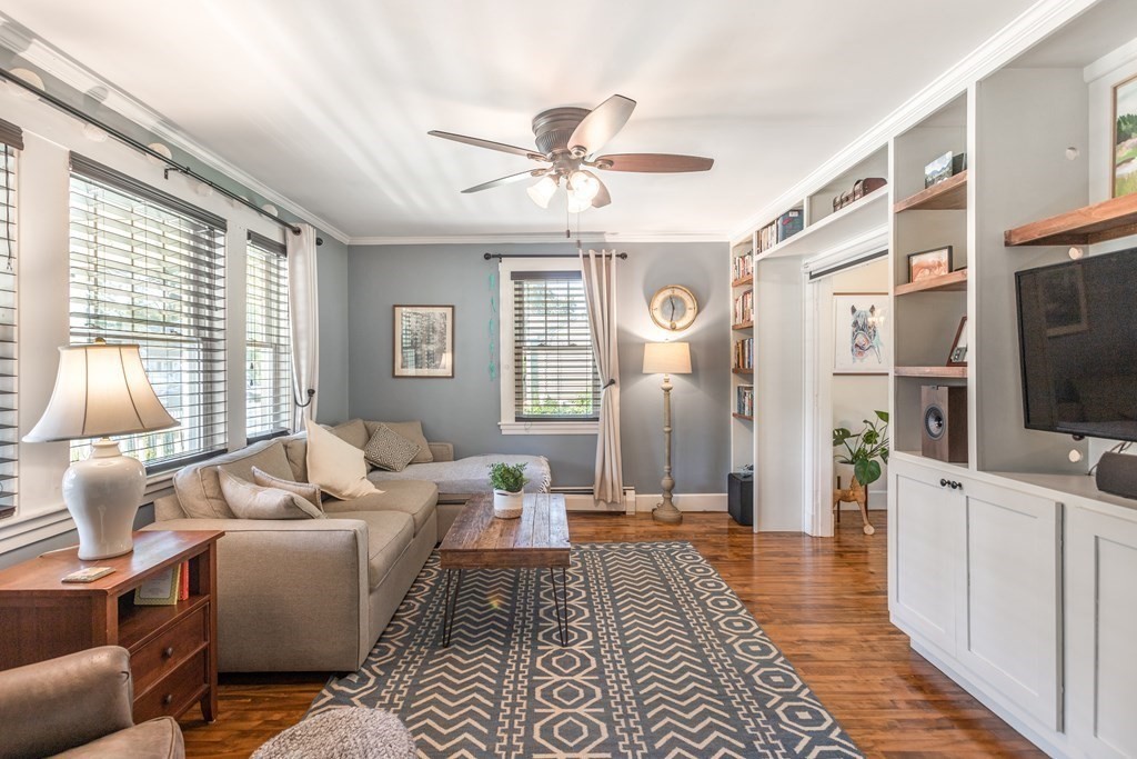 7 Charles Street Maynard, MA 01754 - Photo 10 of 33 a living room with furniture and a flat screen tv