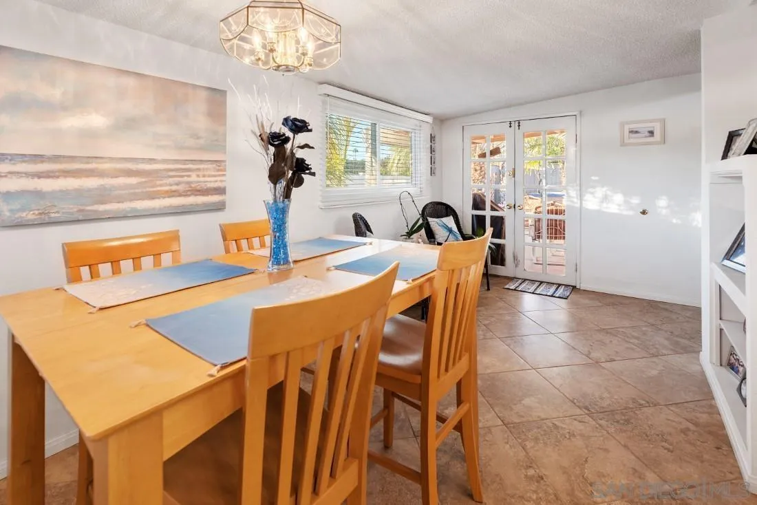 13850 Frame Road Poway, CA 92064 - Photo 14 of 44 a view of a dining room with furniture and a chandelier
