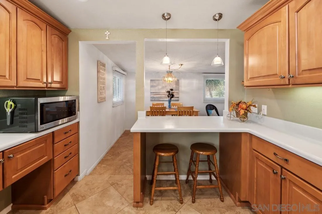 13850 Frame Road Poway, CA 92064 - Photo 16 of 44 a kitchen with a sink cabinets and stainless steel appliances