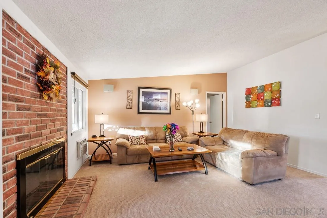 13850 Frame Road Poway, CA 92064 - Photo 23 of 44 a living room with furniture and a fireplace