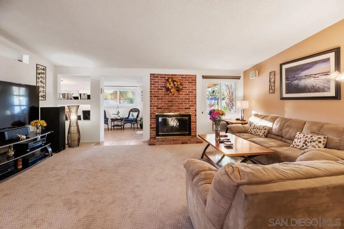 13850 Frame Road Poway, CA 92064 - Photo 25 of 44 a living room with furniture and a flat screen tv