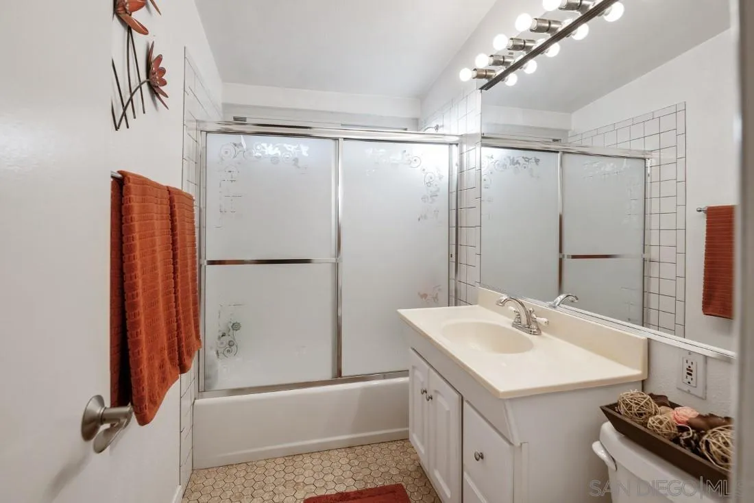 13850 Frame Road Poway, CA 92064 - Photo 26 of 44 a bathroom with a sink double vanity and shower