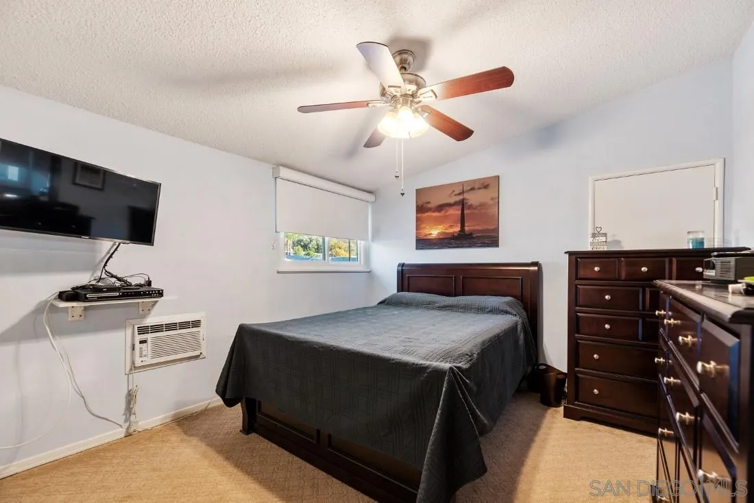 13850 Frame Road Poway, CA 92064 - Photo 28 of 44 a bedroom with a bed and a television