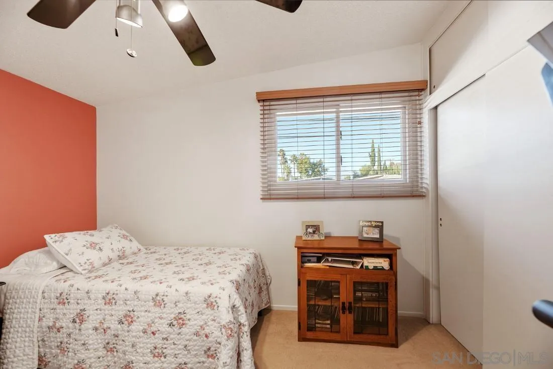 13850 Frame Road Poway, CA 92064 - Photo 29 of 44 a bedroom with a bed and a chair