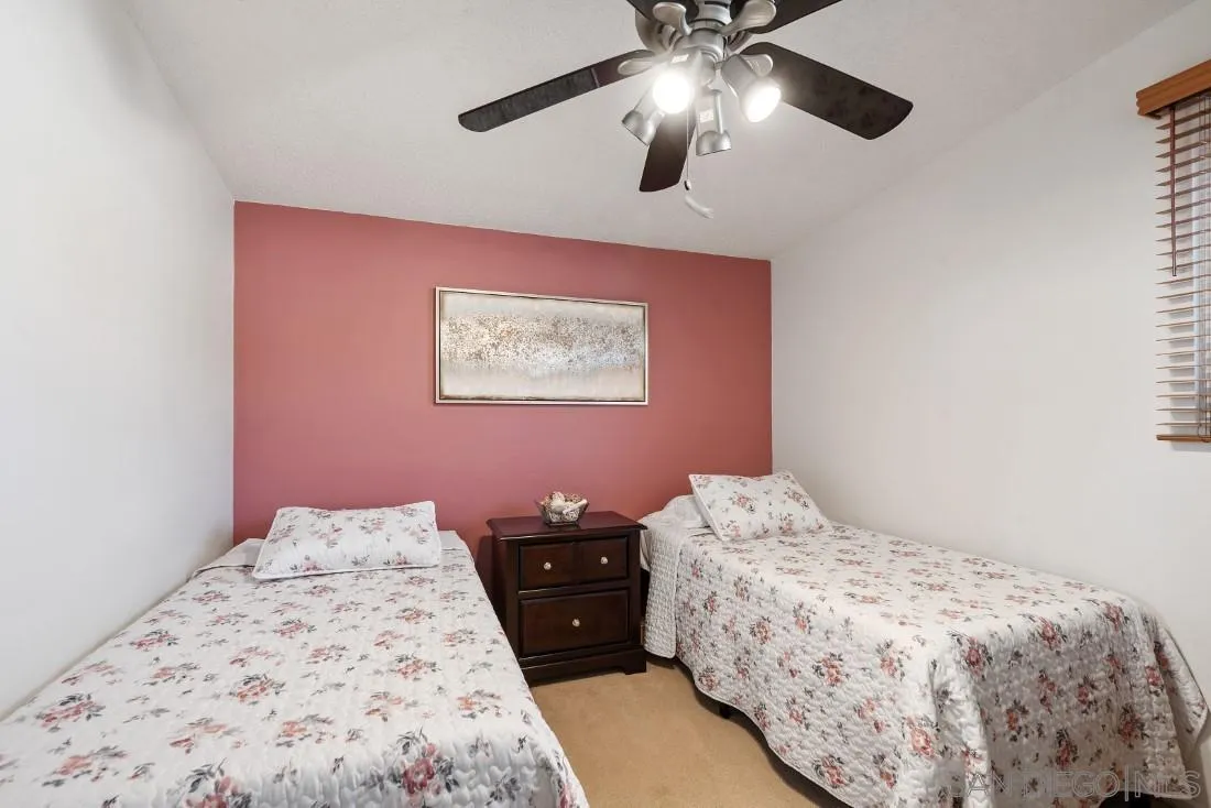 13850 Frame Road Poway, CA 92064 - Photo 30 of 44 a bedroom with a bed and a painting on the wall