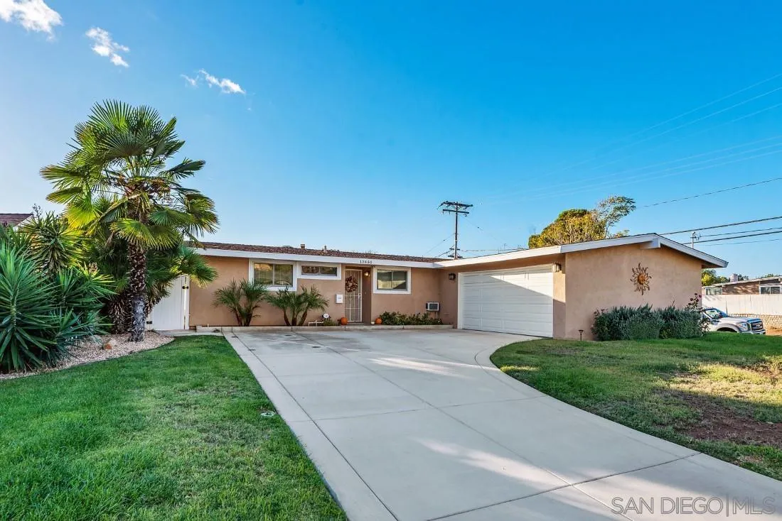 13850 Frame Road Poway, CA 92064 - Photo 5 of 44 a front view of a house with a yard and garage