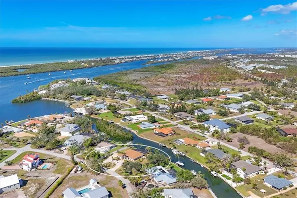 an aerial view of ocean and city