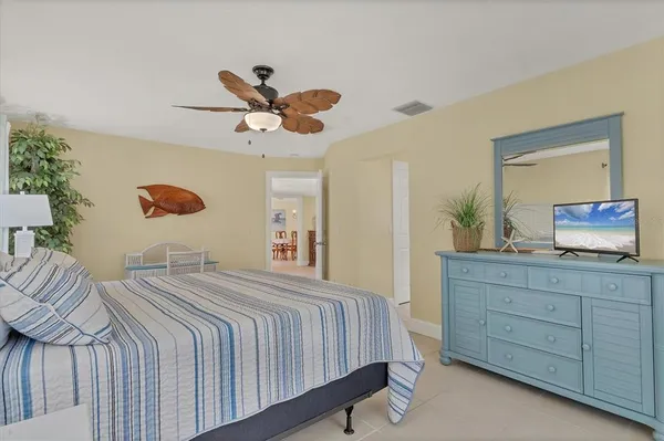 a bedroom with a bed and a large dresser