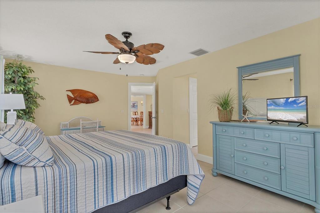 30 Buccaneer Bend Placida, FL 33946 - Photo 24 of 38 a bedroom with a bed and a large dresser