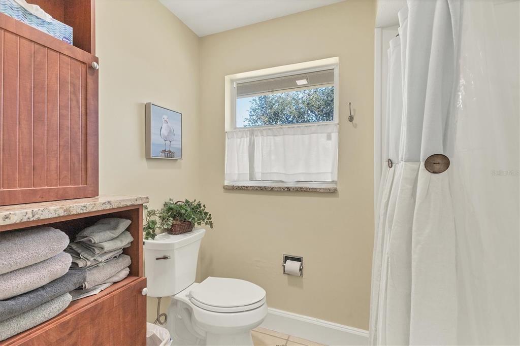 30 Buccaneer Bend Placida, FL 33946 - Photo 26 of 38 a bathroom with a toilet a sink and a window