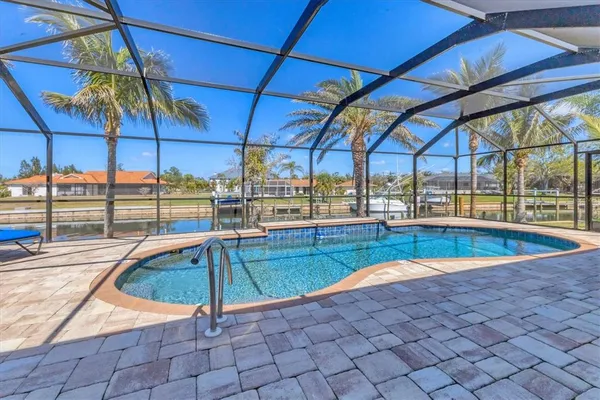 a view of a swimming pool with a lounge chairs