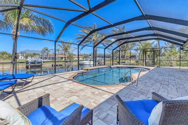 a view of a swimming pool with a patio