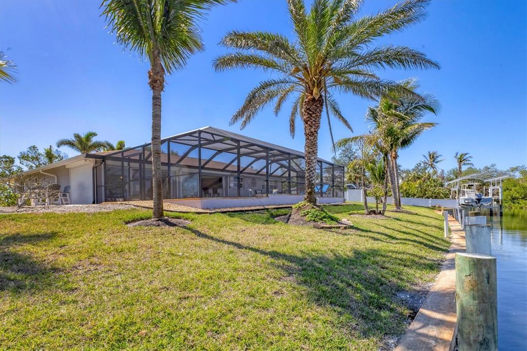 30 Buccaneer Bend Placida, FL 33946 - Photo 36 of 38 a view of a backyard with a small pool