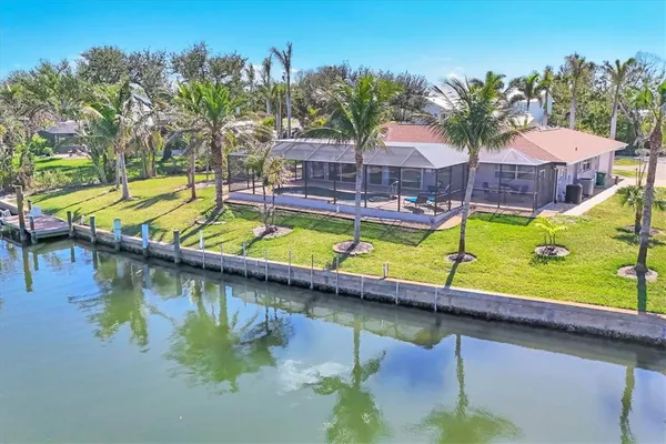 an aerial view of a house with a swimming pool