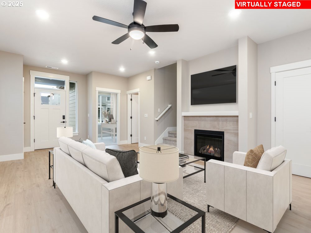2474 North Vale Street Newberg, OR 97132 - Photo 2 of 11 a living room with furniture a fireplace and a flat screen tv