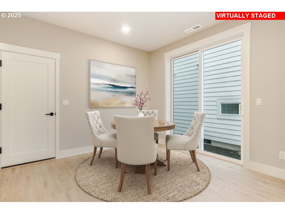 2474 North Vale Street Newberg, OR 97132 - Photo 4 of 11 a view of a dining room with furniture and wooden floor