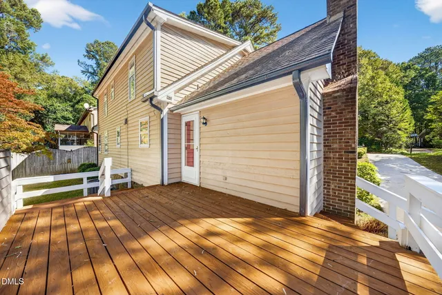 a view of deck with two chairs and wooden floor