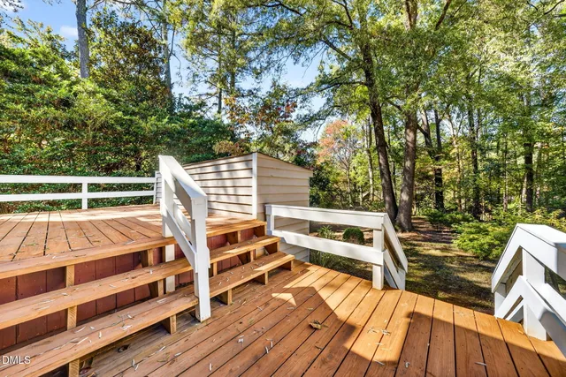 a view of backyard with seating space and yard in back