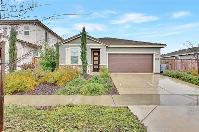 front view of house next to a yard