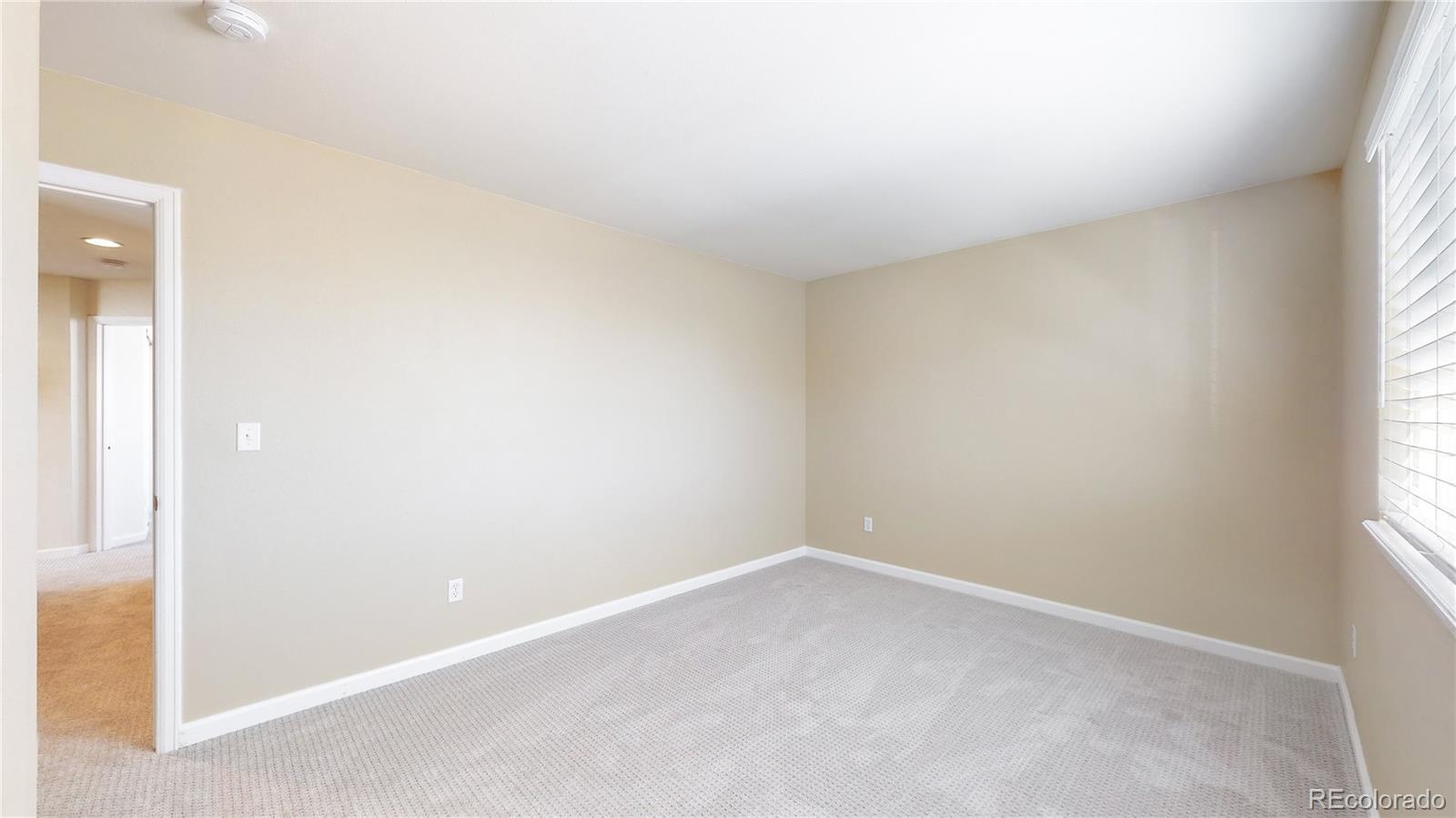 4841 Tarcoola Lane Highlands Ranch, CO 80130 - Photo 21 of 39 a view of an empty room and a window