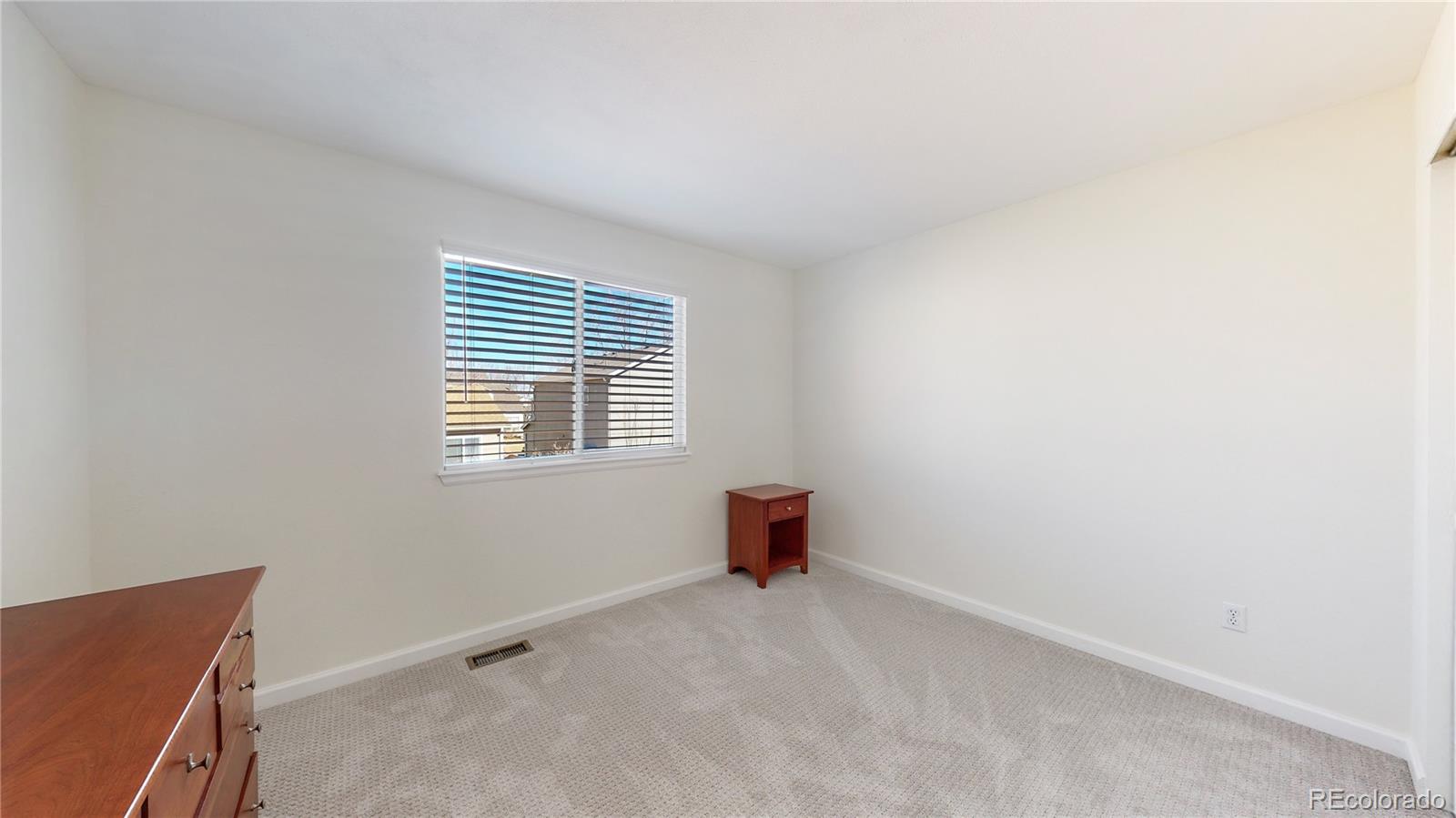 4841 Tarcoola Lane Highlands Ranch, CO 80130 - Photo 22 of 39 a view of an empty room and a window