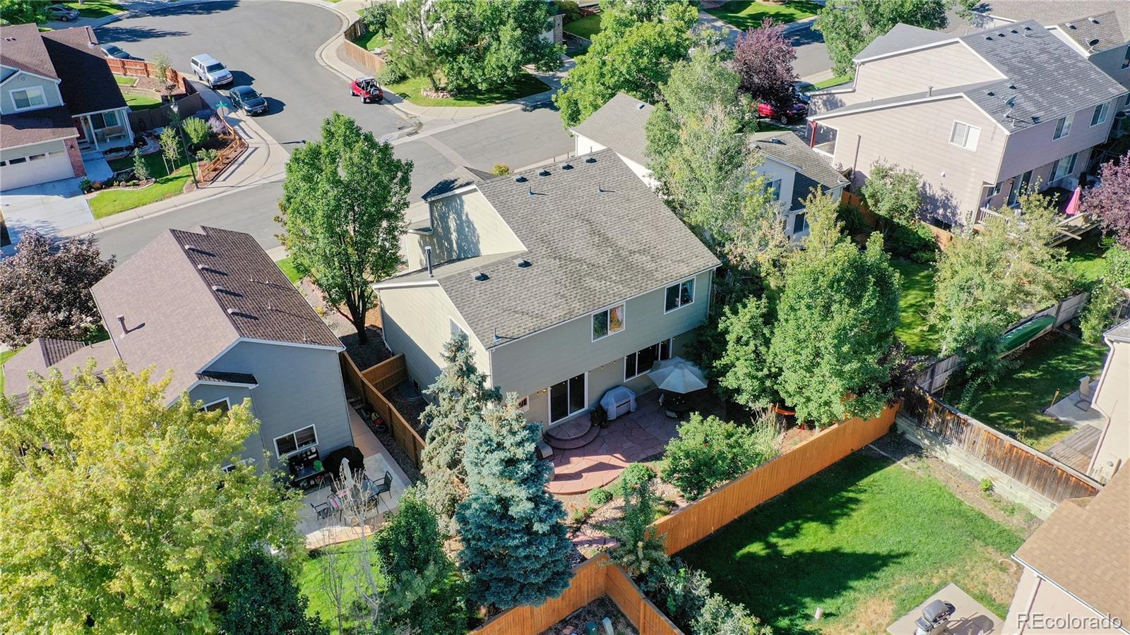 4841 Tarcoola Lane Highlands Ranch, CO 80130 - Photo 29 of 39 an aerial view of a house with a yard basket ball court and outdoor seating
