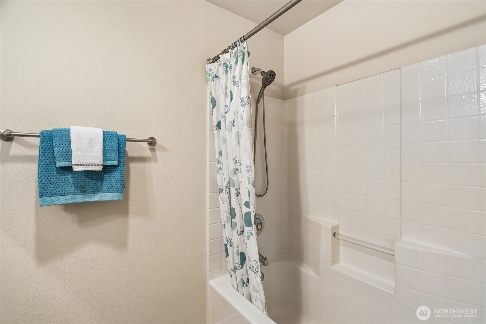 18930 Bothell Everett Highway, Unit E301 Bothell, WA 98012 - Photo 18 of 28 a bathroom with a shower curtain and a sink