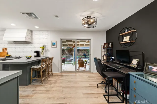 a kitchen with a sink appliances and cabinets
