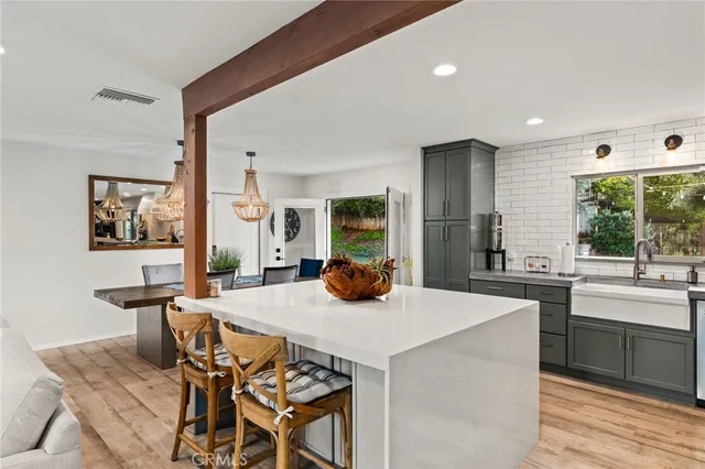 a kitchen with a table and chairs in it