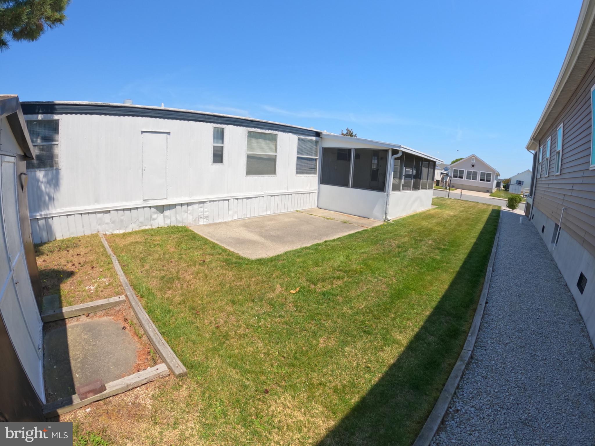 163 Clamshell Road Ocean City, MD 21842 - Photo 15 of 18 a view of a back yard of the house
