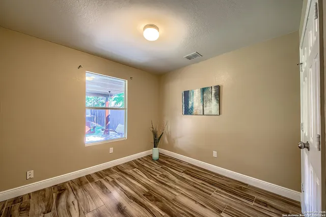 a view of an empty room and window