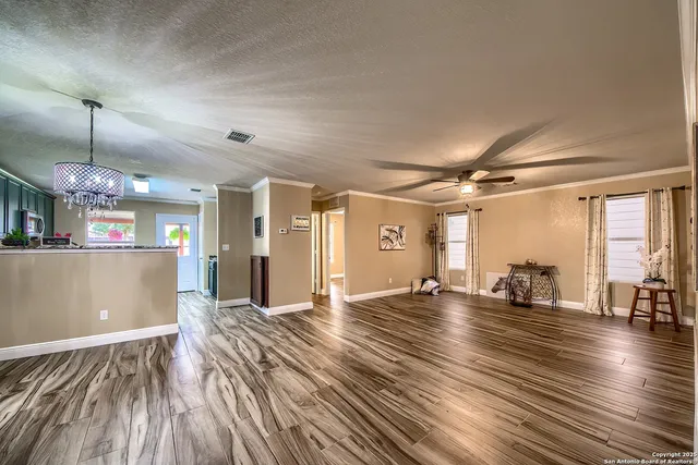 a view of a room with lots of wooden floor