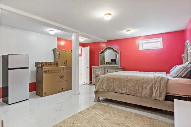 a front view of a house with a yard and trees