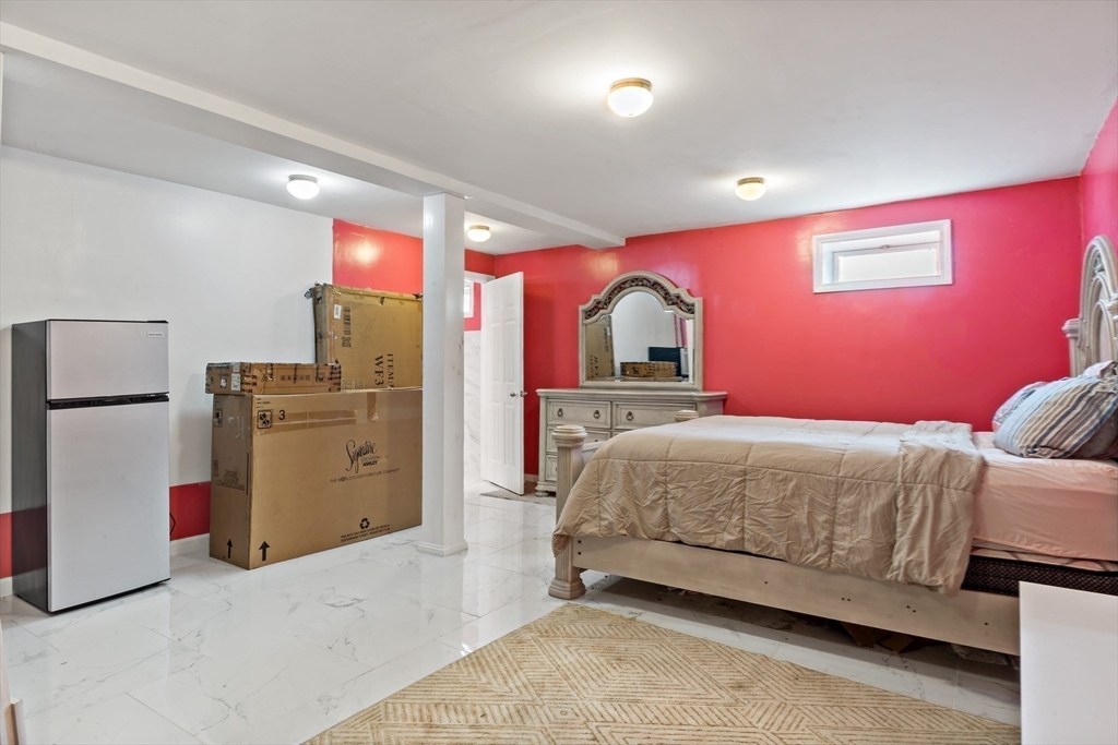 45 Fourth Street Worcester, MA 01602 - Photo 14 of 21 a bedroom with a bed and cabinets