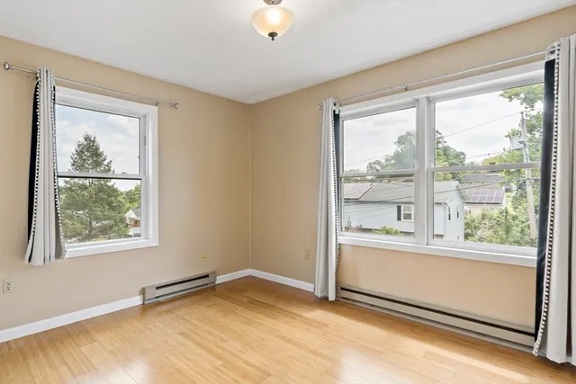 a bedroom with a bed and cabinets