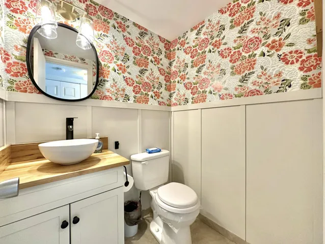 a bathroom with a toilet and a sink