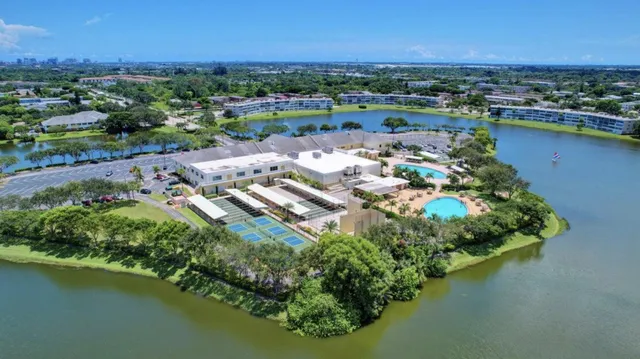 an aerial view of a house with a lake view