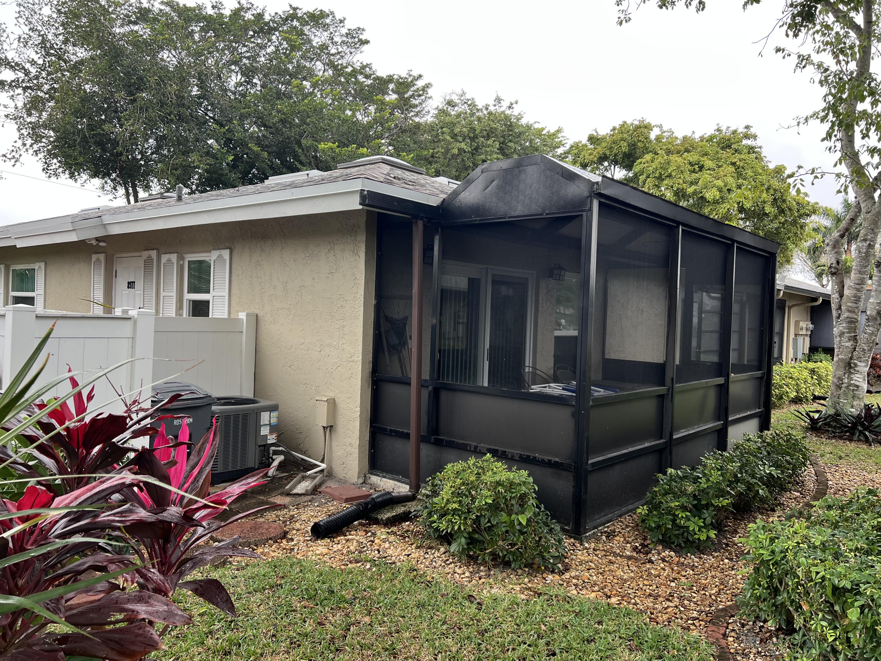 8977 Echo Lane, Unit D Boca Raton, FL 33496 - Photo 11 of 13 a backyard of a house with seating space