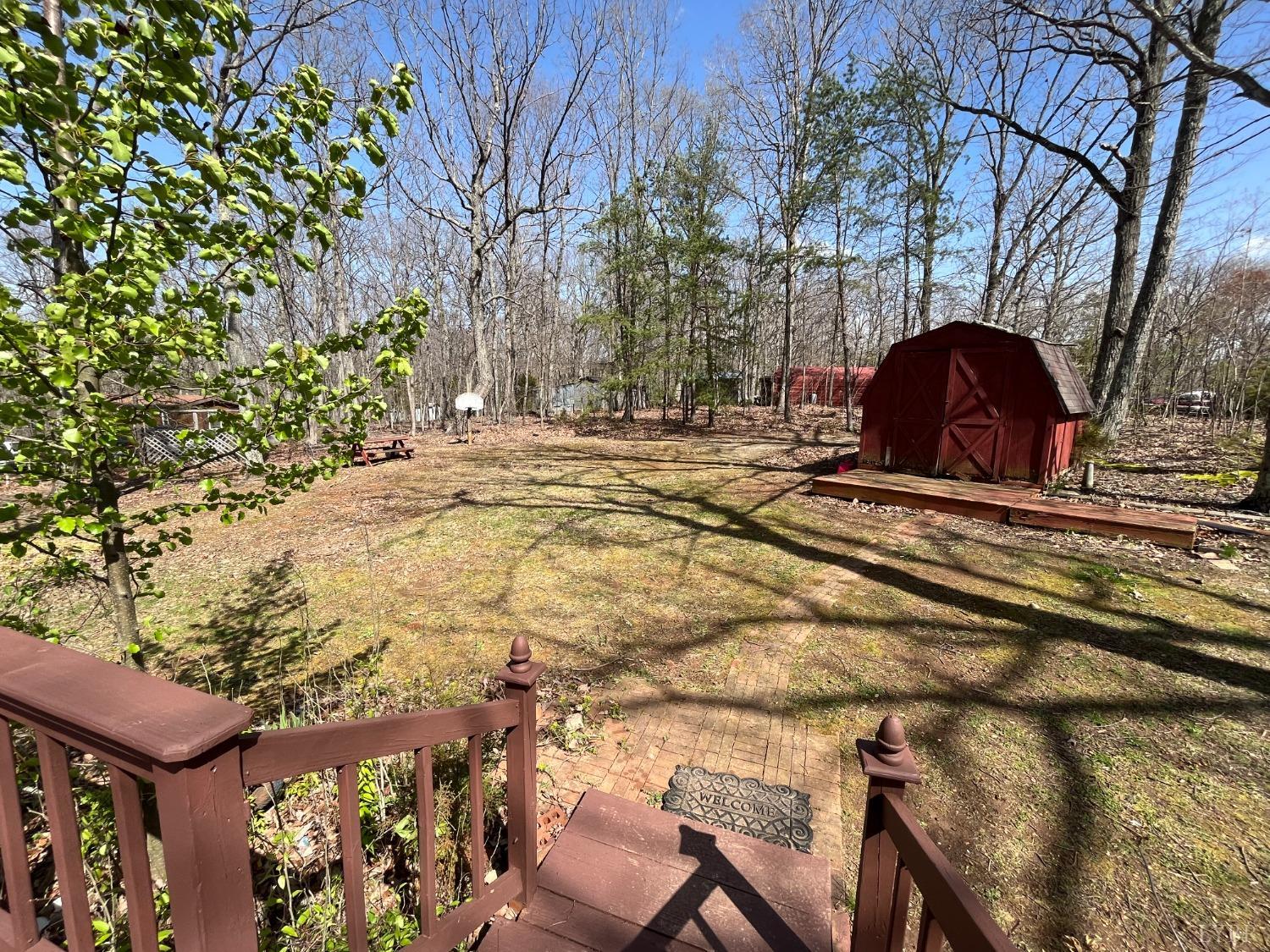 33 Pin Oak Court Evington, VA 24550 - Photo 17 of 19 a view of a yard with plants and trees