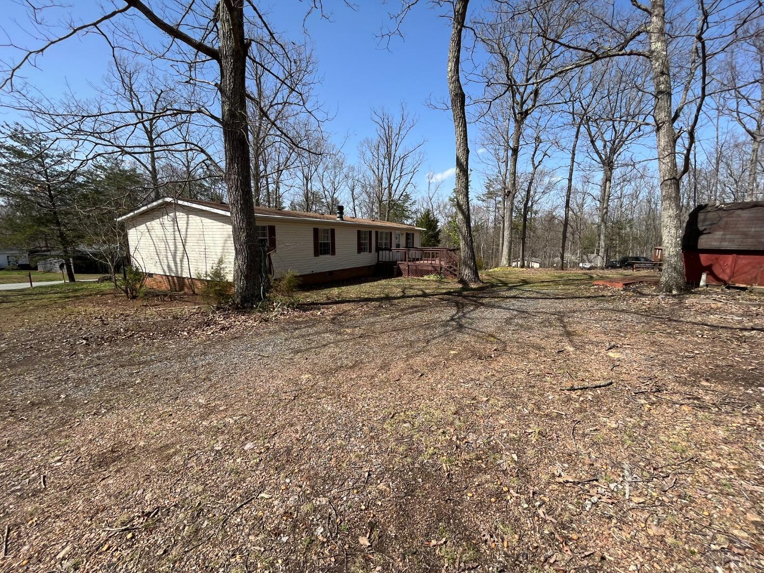 33 Pin Oak Court Evington, VA 24550 - Photo 19 of 19 a backyard of a house with oven and wooden fence