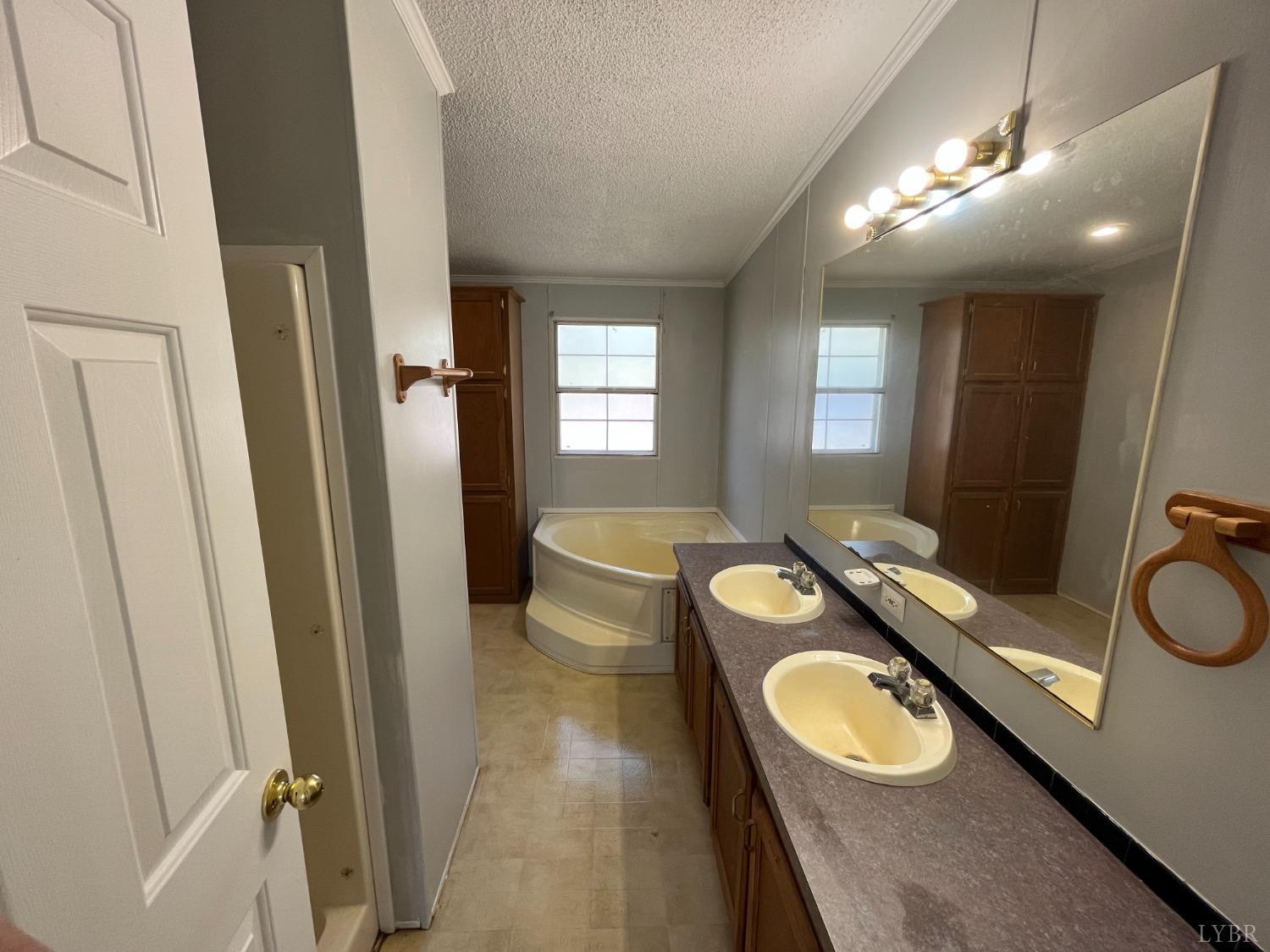 33 Pin Oak Court Evington, VA 24550 - Photo 5 of 19 a bathroom with a granite countertop sink toilet and a mirror