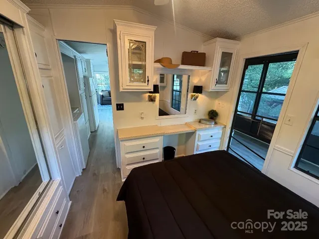 a view of living room with a flat tv screen and a dresser