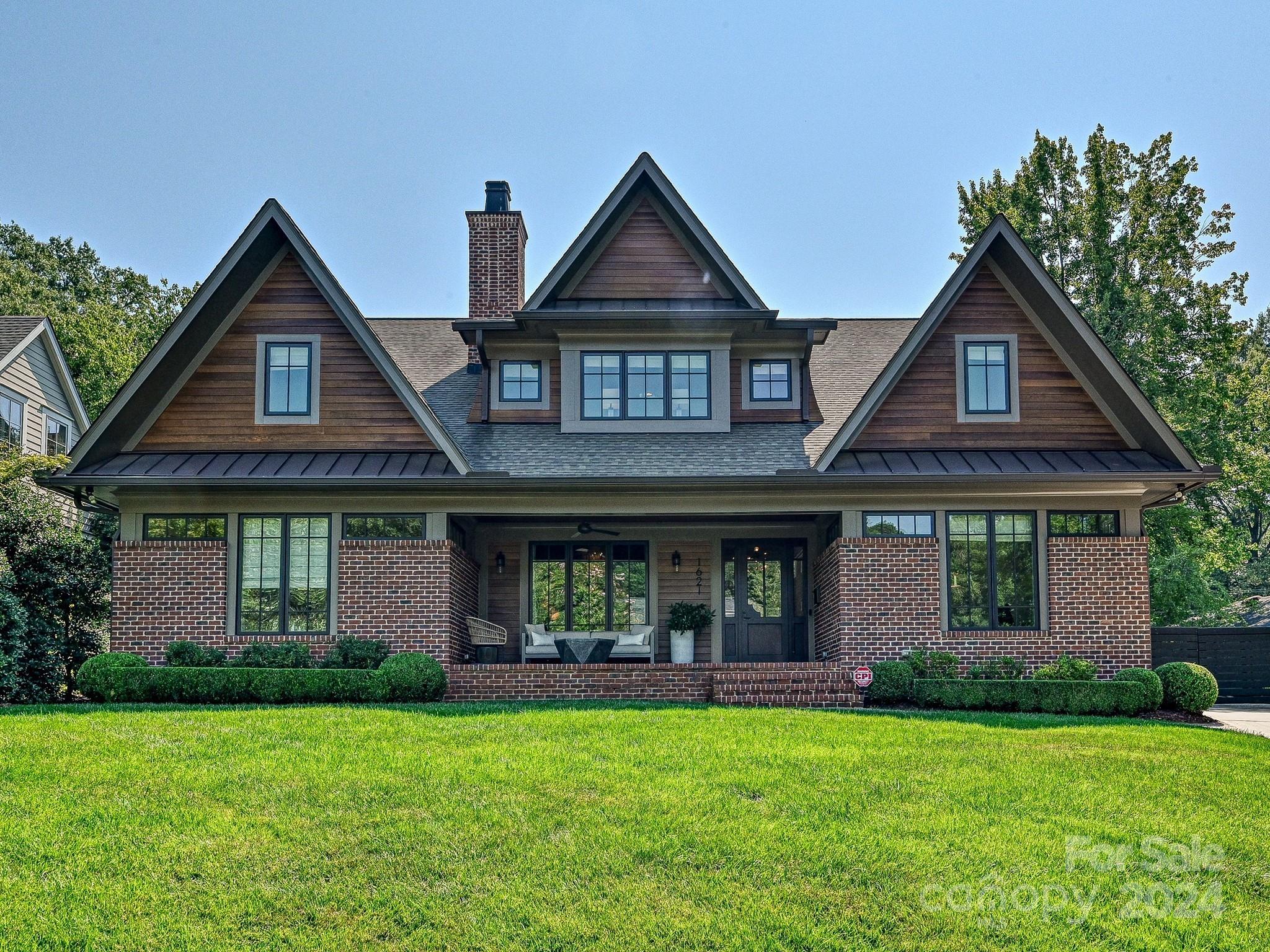 1621 Sterling Road Charlotte, NC 28209 - Photo 1 of 48 a front view of a house with garden