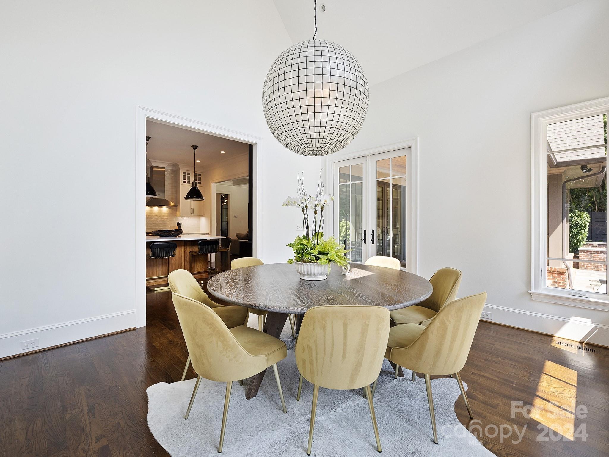 1621 Sterling Road Charlotte, NC 28209 - Photo 18 of 48 a dining room with furniture a rug and wooden floor