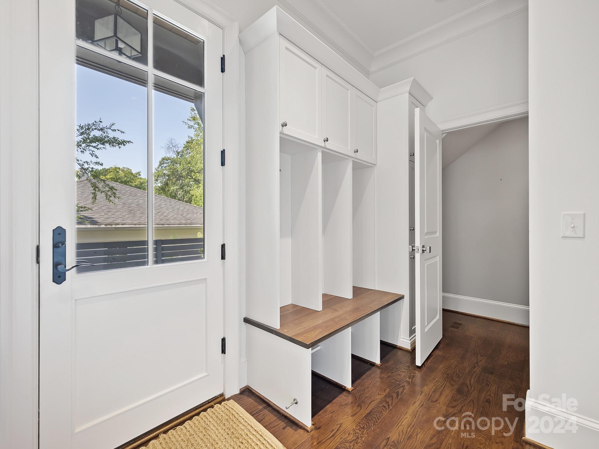 1621 Sterling Road Charlotte, NC 28209 - Photo 19 of 48 a view of an empty room with wooden floor and a window