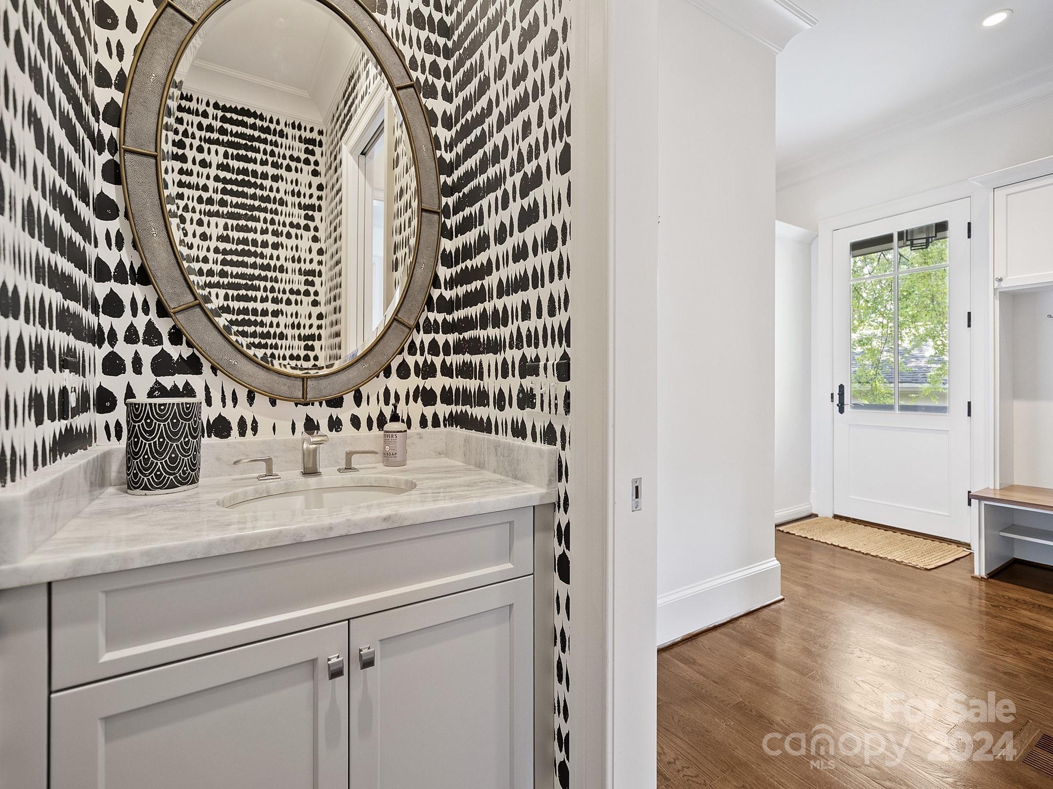 1621 Sterling Road Charlotte, NC 28209 - Photo 21 of 48 a close view of bathroom with a granite countertop sink and a mirror
